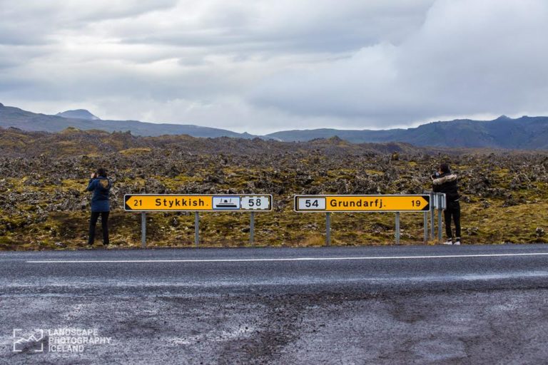Road signs for Stykish and Grundarfjörður along Icelandic landscape.