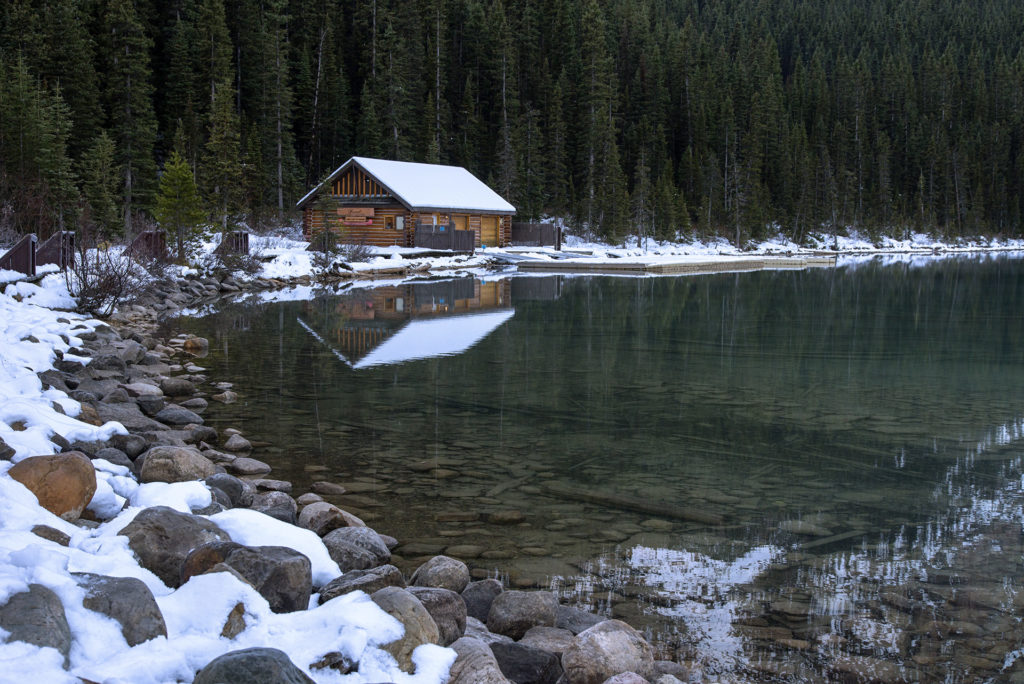 Cabin on lake louse in snow