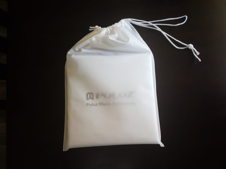 White drawstring gift bag for elegant packaging and presentation.