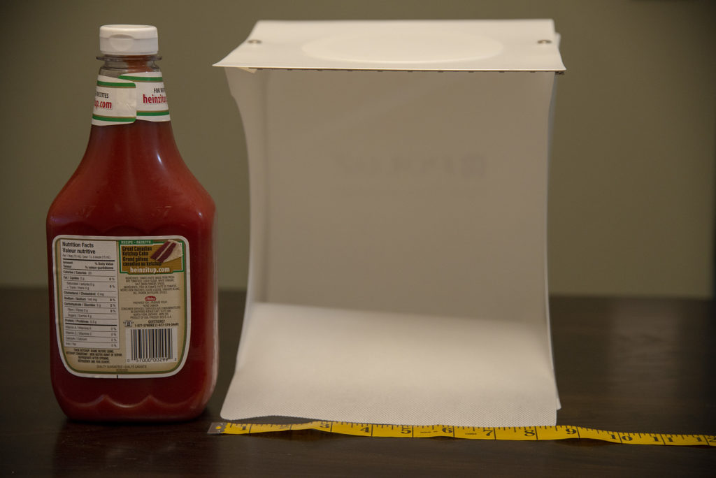 mini portable light box beside ketchup bottle